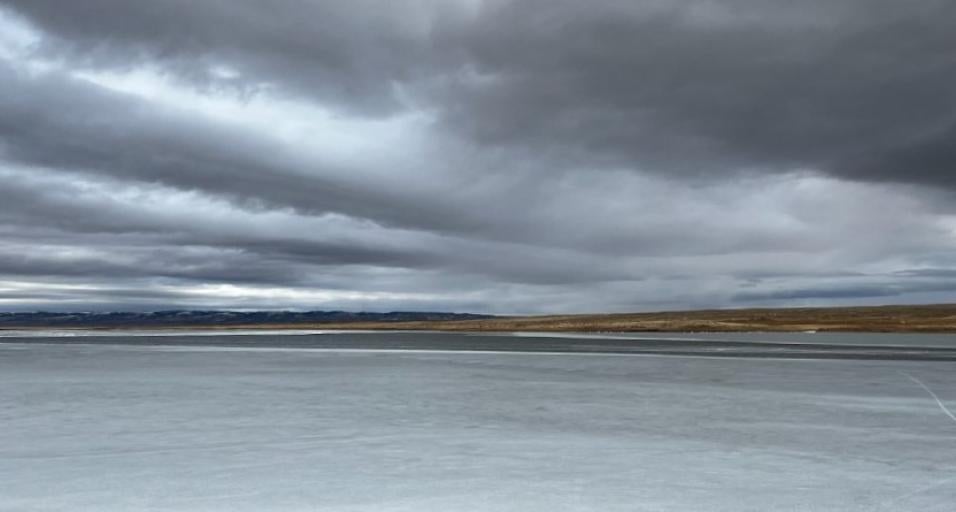 Dark stormy clouds over an ice covered Meeboer Lake
