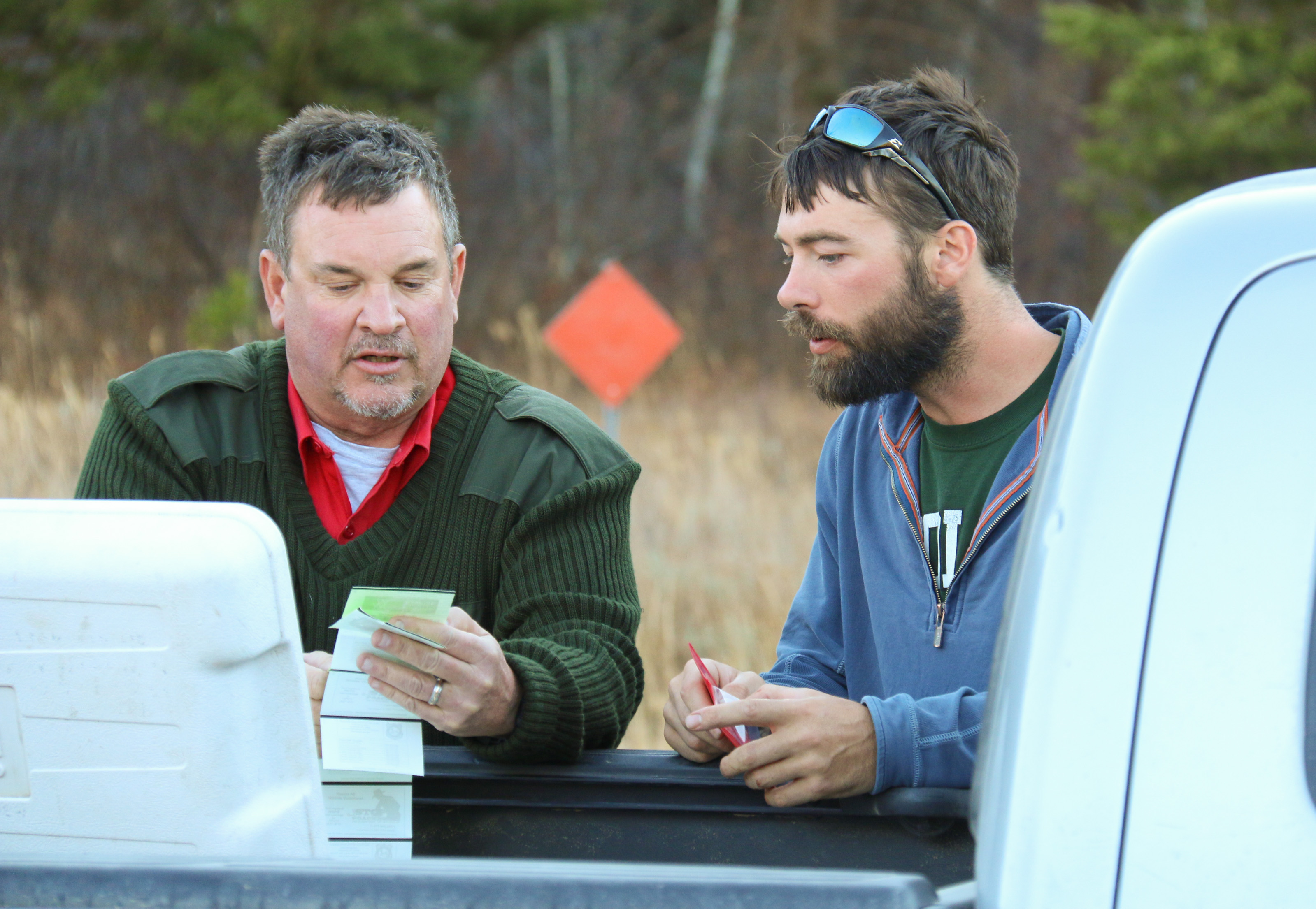 edberg talks with a hunter at a checkstation