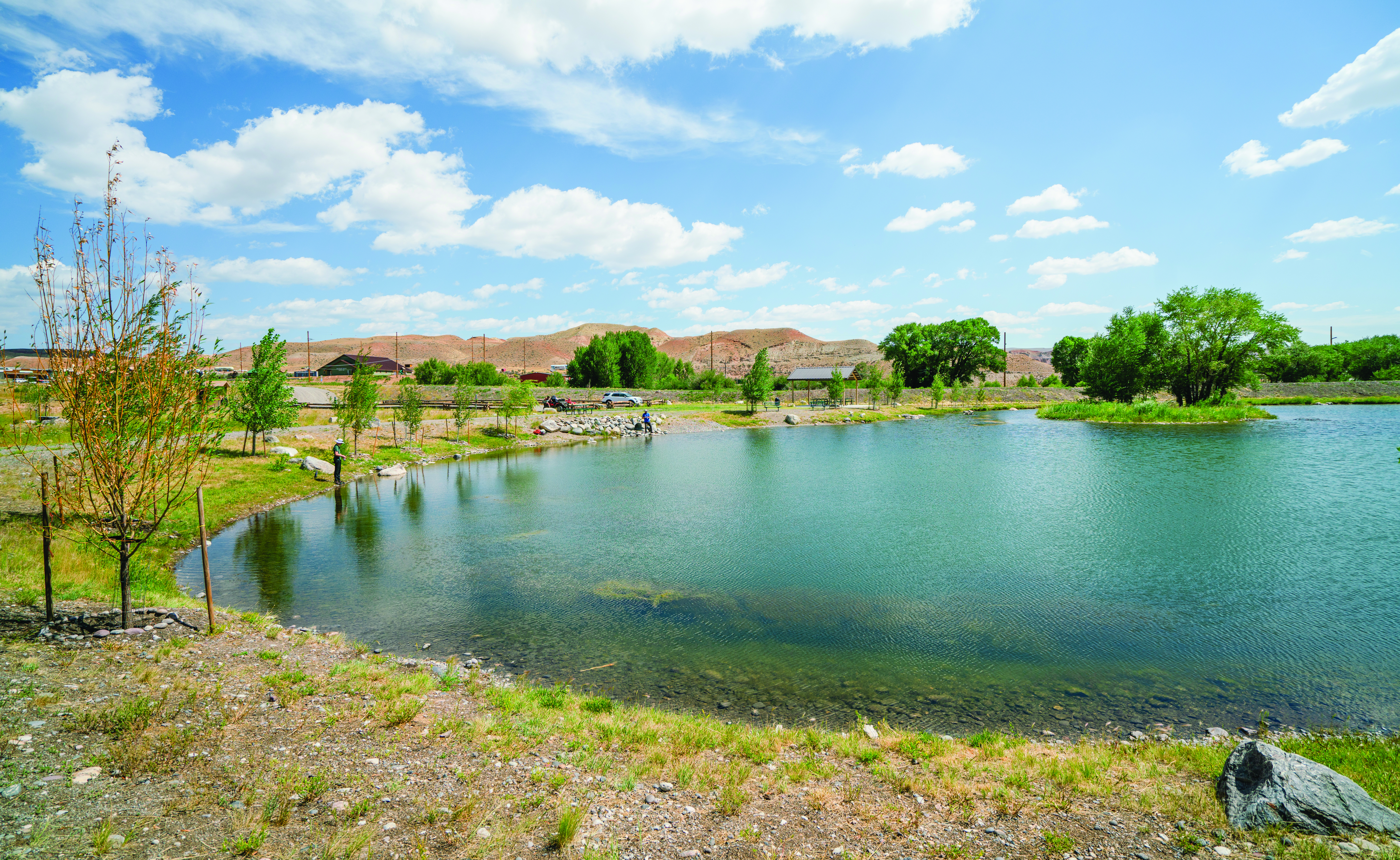 A landscape photo of Pete's Pond near Dubois Wyoming with a partly cloudy sky