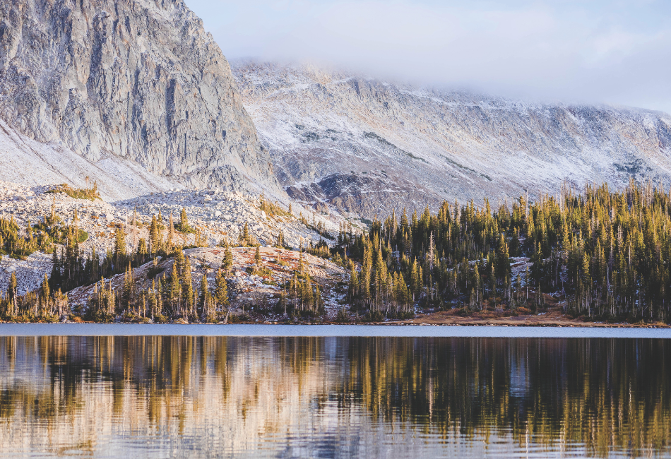 A landscape photo of Lake Marie and surrounding rocky peaks in the Snowy Range mountains outside of Centennial, Wyoming.