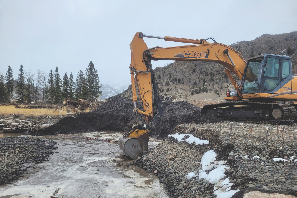 Kade Clark, Game and Fish habitat access technician, operates an excavator while working in the Sunlight Basin. Wildlife Habitat Management Area.