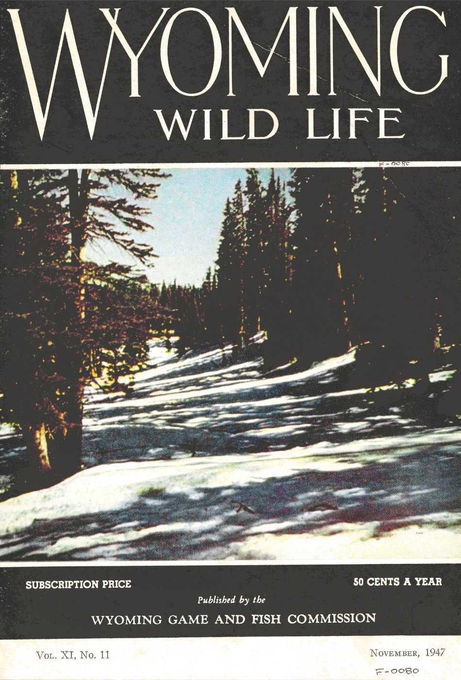 The November 1947 cover of Wyoming Wild Life magazine featuring a color photograph of a snowy forest.