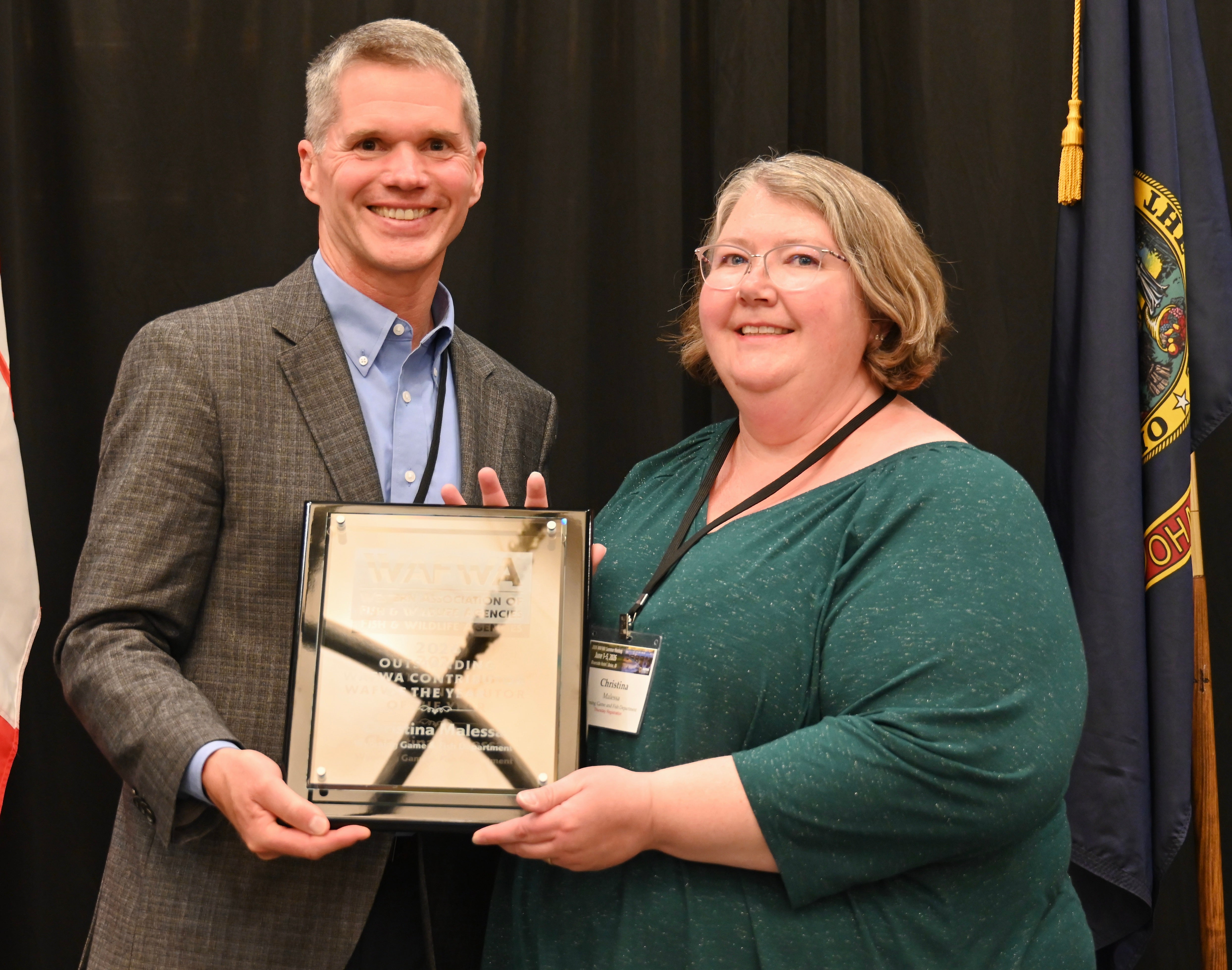 Christina Maleesa (right) accepts the Outstanding Western Association of Fish and Wildlife Agencies Contributor of the Year