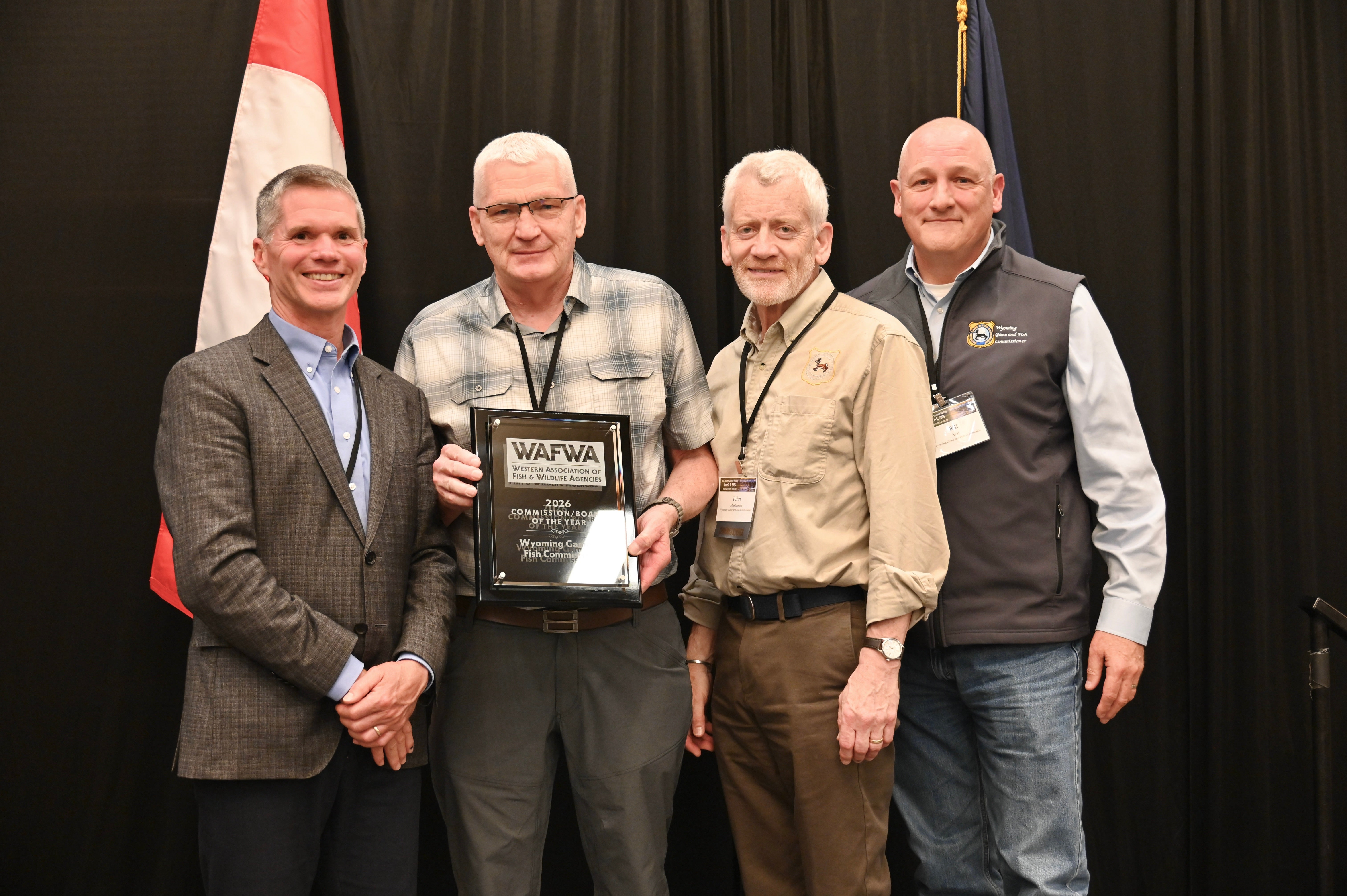 Wyoming Game and Fish Commissioners accept the 2026 Western Association of Fish and Wildlife Agencies Commission/Board of the Year Award. From left: WAFWA President Jim Fredericks, Commissioner Kenneth Roberts, Commissioner John Masterson, Commissioner Bill Mai. Not pictured: Commission President Mark Jolovich, Commission Vice President Rusty Bell, Commissioner Ashlee Lundvall, Commissioner Fonzy Haskell