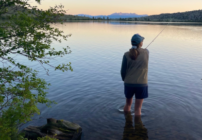 Participant fishing at sunrise