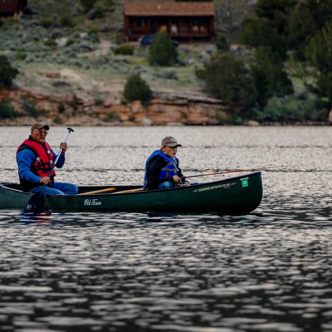 Family in canoe with life jackets