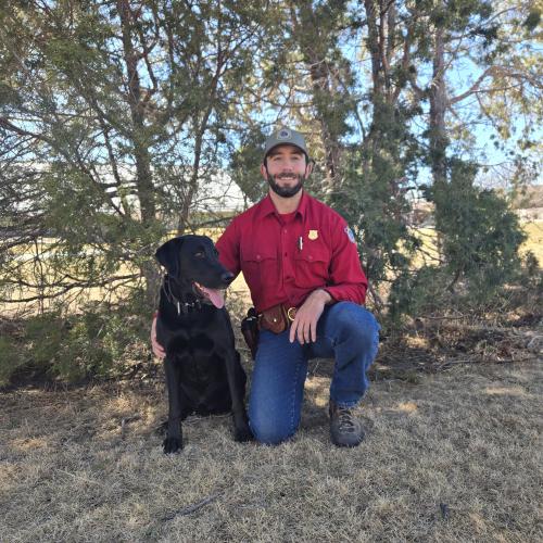 Clayton McCall and his black lab