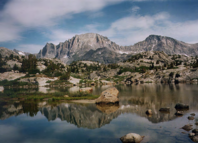 A high alpine lake with Fremont Peak and the Wind River Range as the backdrop