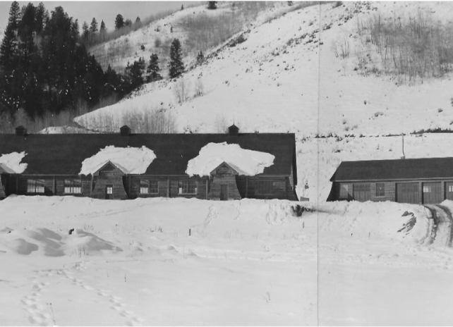 A historical black and white photo of Auburn Fish Hatchery blanketed in snow taken on December 7, 1944.