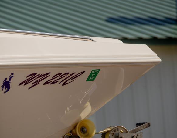 A hull identification number, or HIN, followed by an AIS decal on a motorized watercraft