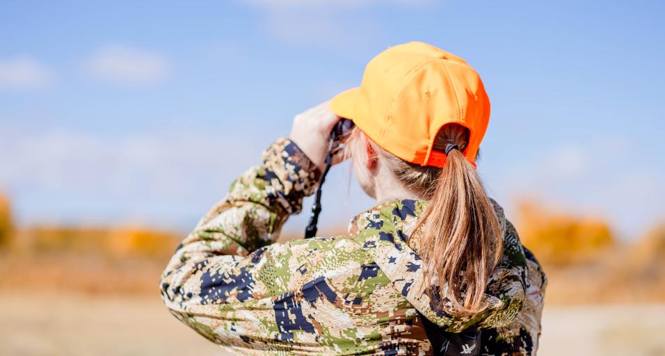 Woman hunting wearing orange