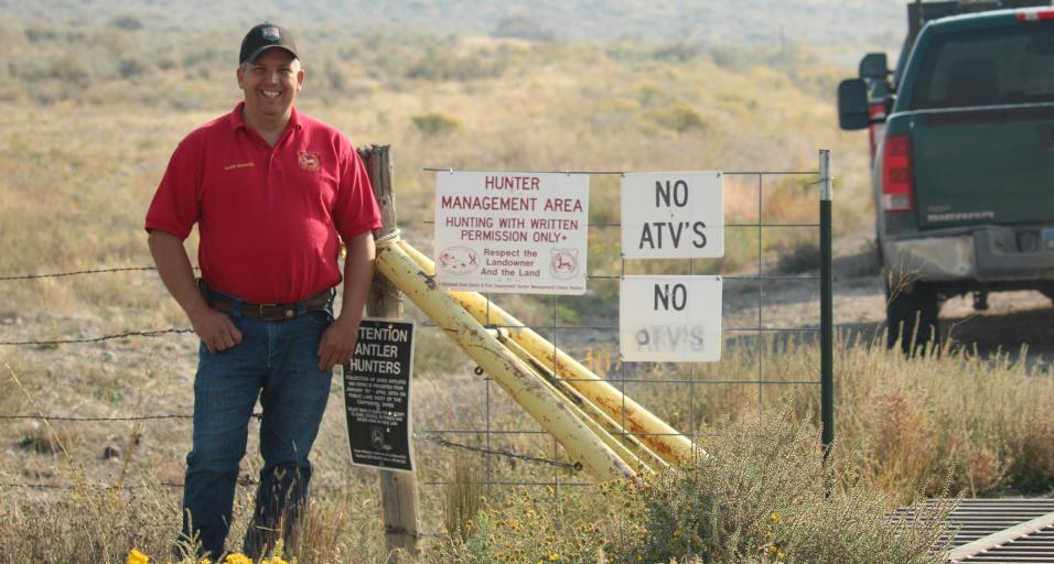 Hunter management area, game warden smiling