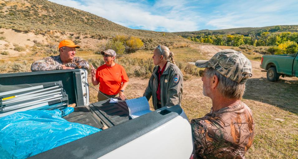 Game warden checking hunters