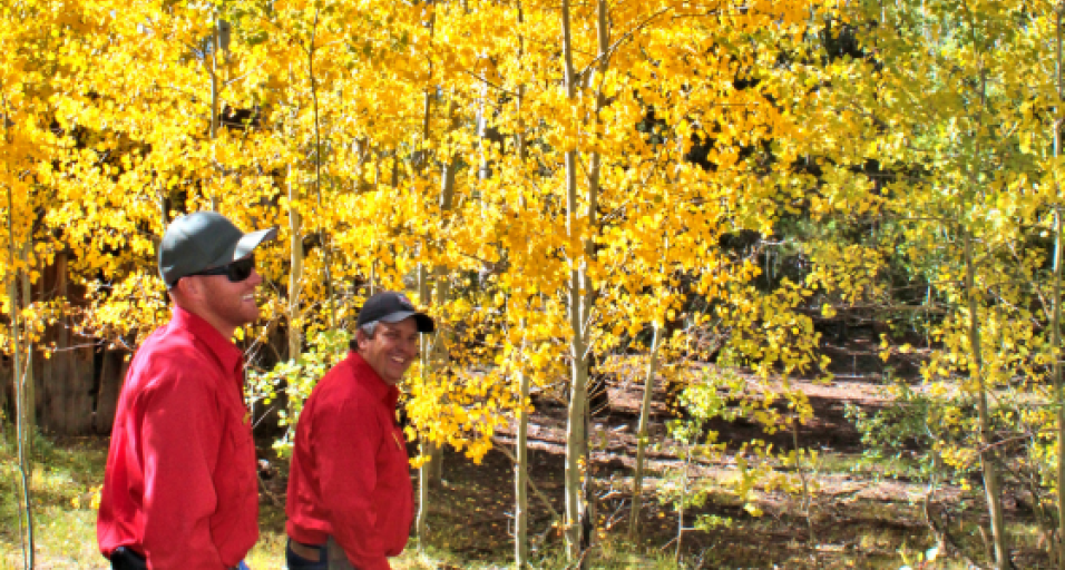 Allen Deru and Andy Countryman smile with Aspen trees in the background