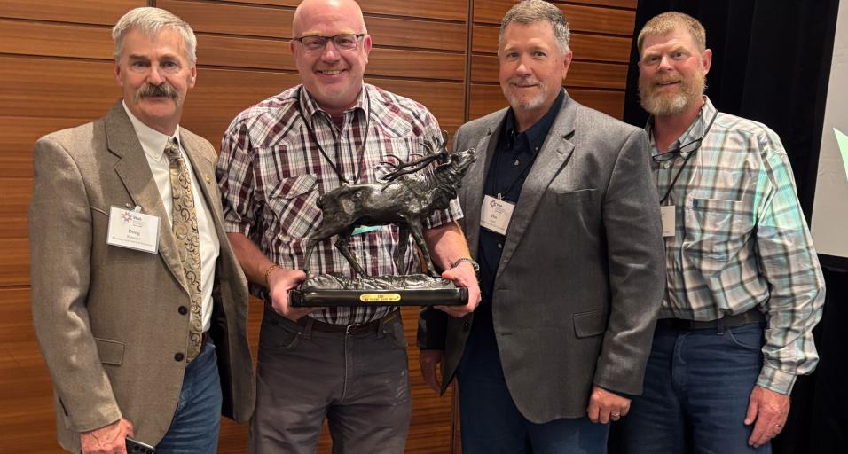 From left: Game and Fish Deputy Director External Operations Doug Brimeyer, Wildlife Management Coordinator and award recipient Daryl Lutz, Chief Game Warden Dan Smith, Deputy Chief Wildlife Division Martin Hicks.