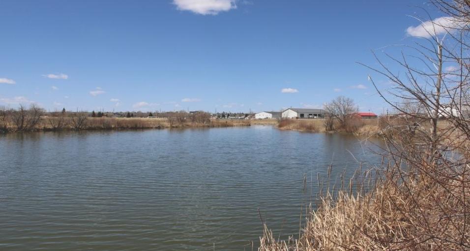 A landscape photo of pasture pond on the campus of Laramie County Community College.