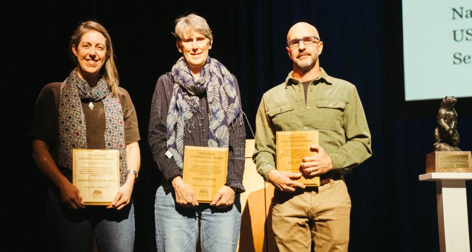 Aly Courtemanch (left), Sarah Dewey (center), and Eric Cole (right) accept the Craighead Conservation Award at the 2026 Northern Rockies Conservation Symposium (courtesy of Northern Rockies Conservation Cooperative).