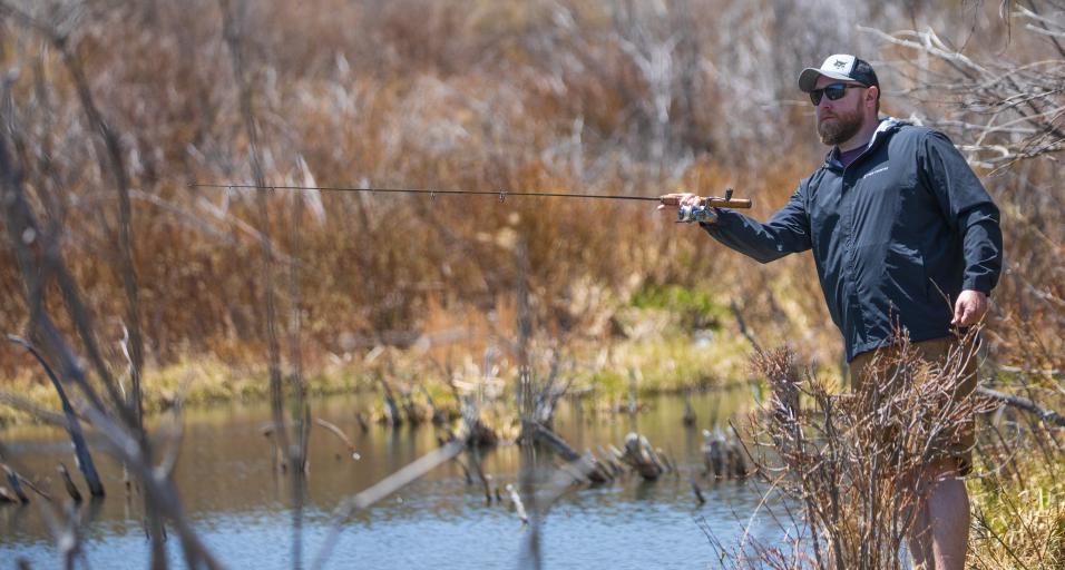 Angler fishing in the snowy mountain range