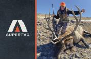 Super Tag Logo with hunter posing with harvested bull elk.