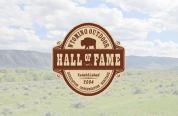 Wyoming Outdoor Hall of Fame logo with scenic background.
