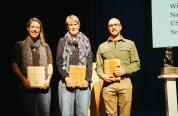 Aly Courtemanch (left), Sarah Dewey (center), and Eric Cole (right) accept the Craighead Conservation Award at the 2026 Northern Rockies Conservation Symposium (courtesy of Northern Rockies Conservation Cooperative).
