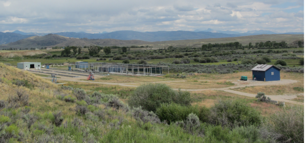 A wide shot of Boulder Rearing Station with the Wind River Mountains in the background