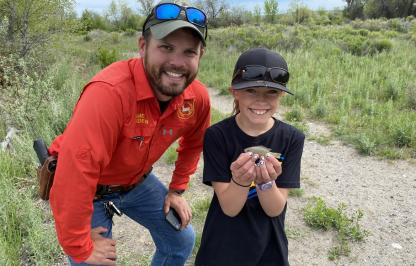 Access Coordinator Jon Desonier and youth angler Faith Edwards pose with her fish Access Coordinator Jon Desonier and youth angler Faith Edwards pose with her fish