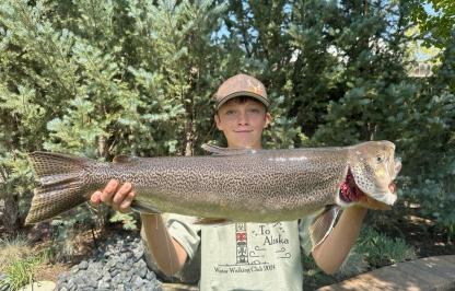 Jaxon Krall holding state record tiger trout 