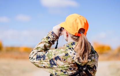 Woman hunting wearing orange