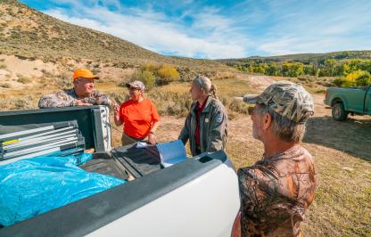 Game warden checking hunters