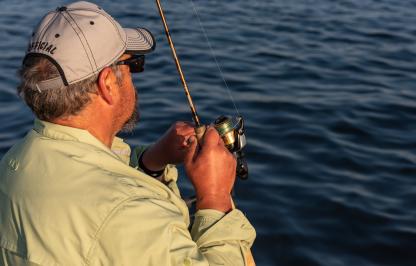 Robb Keith reels in a fish at Fontenelle Reservoir