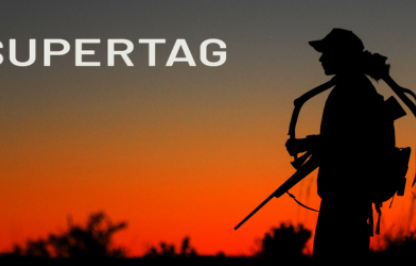 Super Tag Logo with hunter posing with harvested elk buck.