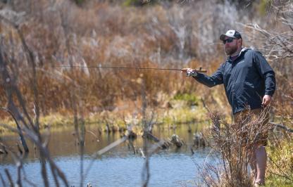 Angler fishing in the snowy mountain range
