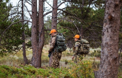 Two hunters with blaze orange hats