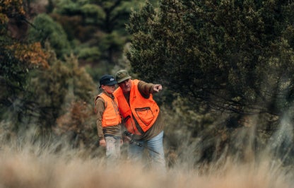 Father and son hunting in blaze orange
