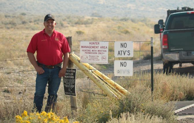 Hunter management area, game warden smiling