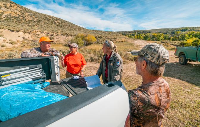 Game warden checking hunters