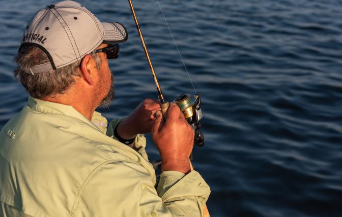 Robb Keith reels in a fish at Fontenelle Reservoir