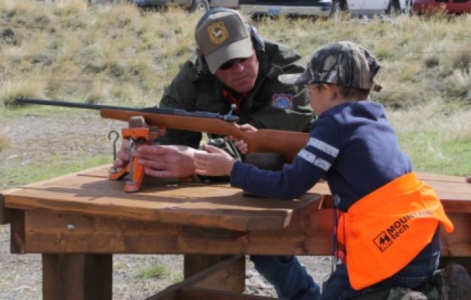 Instructor helps youth during hunter range day