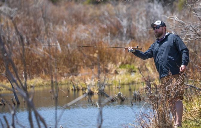 Angler fishing in the snowy mountain range